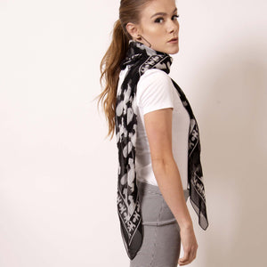 Don't think in a box when it comes to a square scarf.  Transform  artskul's edgy Baby Pop Medium Square Scarf into a vest to summon your boss babe self at the office.  ärtskül scarves are statement pieces, adding edgy sophistication to any style that it’s paired with - from a Zoom meeting on screen and into the evening. 