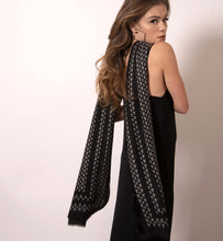 Load image into Gallery viewer, ärtskül’s Baby Pop, Nana Rectangle scarf is high style with minimal effort. It’s all about ease and simply Luxuriously soft, this eye-catching cashmere blend scarf features our baby icon in our remixed houndstooth pattern drapes elegantly and adds a playful and polished look to this minimalist slip dress. Lightweight and warming, this classic black and white scarf amps up the glamour for those that don’t want to blend in.