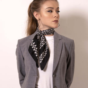 Artskul's Baby Pop Nana Scarf in silk twill is irresistibly chic in  black and white. Shift your image from frivolous fashionista to polished professional with a creative edge. The scarf features the remixed houndstooth pattern with the baby icon and adds a signature look to a crisp white fitted shirt. 