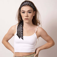 Load image into Gallery viewer, Rock your locks with ärtskül's chic black and white Baby Pop Ribbon Scarf. Make a statement with this scarf as a headband or creatively incorporate the scarf into your other hairstyles.