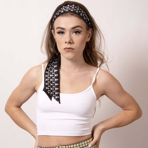 Rock your locks with ärtskül's chic black and white Baby Pop Ribbon Scarf. Make a statement with this scarf as a headband or creatively incorporate the scarf into your other hairstyles. 