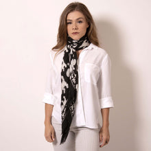 Load image into Gallery viewer, Artskul&#39;s Baby Pop Large Square Cashmere Blend Scarf can be folded and rolled to emulate a longer oblong scarf which can be  wrapped with a loop knot and tied for this cozy look. Smooth and soft to the touch, you&#39;ll love the way it feels against your neck.  The striking geometric repetition produces a chic re-imagining of the centuries old hounds tooth Scottish mosaic.  ärtskül’s remixed pattern captivates the eye while paying homage to the classic print that is admired the world over. 
