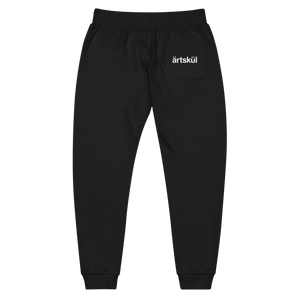 ärtsküls premium unisex joggers are incredibly comfortable and stylish. Soft washed to the touch, they feature the ärtskül logo on the left leg and the logo on the back pocket. The sweatpants feature angled side pockets, a ribbed bottom cuff, and a waistband with a tapered fit. There are flat drawcords and a ribbed gusset at the crotch. 100% cotton on the outside and a 65% cotton/35% polyester blend on the inside.