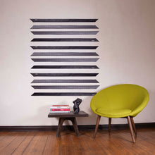 Load image into Gallery viewer, ärtskül's Baby Pop Ribbon Scarf is featured as wall decor. The Ribbon scarf creates an interesting design on your wall and when you are ready to visually reinvent your space, gift your favorite friends a scarf with love. The energy of your living space with something meaningful in your home is a great gift to share with the people you love in your circle of friends. Also featured in the image is a torso resin sculpture and custom occasional table by the artist Brian Biedul.