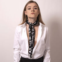 Load image into Gallery viewer, Transform our artskul square scarf into a long skinny scarf with a simple fold and roll. Our classic black and white logo scarf adds a sharp and finished statement to your style.