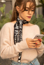 Load image into Gallery viewer, Transform our artskul square scarf into a long skinny scarf with a simple fold and roll. Our classic black and white logo scarf adds a sharp and finished statement to your style.