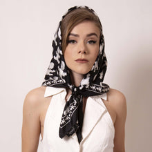 Load image into Gallery viewer, Style inspired by Grace Kelly, wrap ärtskül&#39;s Baby Pop Medium Square Scarf around your head and channel your inner film star. Our remixed houndstooth pattern features the baby icon. Create a little edge and surprise to this modern take on fifties sophistication.  Pair this unique scarf with a jumper for this chic look fit for a princess and creative it girl.