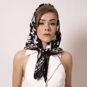 Style inspired by Grace Kelly, wrap ärtskül's Baby Pop Medium Square Scarf around your head and channel your inner film star. Our remixed houndstooth pattern features the baby icon. Create a little edge and surprise to this modern take on fifties sophistication.  Pair this unique scarf with a jumper for this chic look fit for a princess and creative it girl.