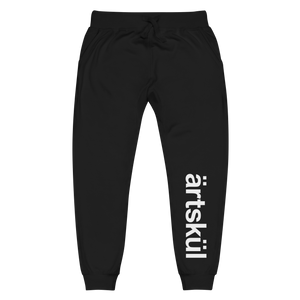 ärtsküls premium unisex joggers are incredibly comfortable and stylish. Soft washed to the touch, they feature the ärtskül logo on the left leg and the logo on the back pocket. The sweatpants feature angled side pockets, a ribbed bottom cuff, and a waistband with a tapered fit. There are flat drawcords and a ribbed gusset at the crotch. 100% cotton on the outside and a 65% cotton/35% polyester blend on the inside.