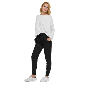 ärtsküls premium unisex joggers are incredibly comfortable and stylish. Soft washed to the touch, they feature the ärtskül logo on the left leg and the logo on the back pocket. The sweatpants feature angled side pockets, a ribbed bottom cuff, and a waistband with a tapered fit. There are flat drawcords and a ribbed gusset at the crotch. 100% cotton on the outside and a 65% cotton/35% polyester blend on the inside.