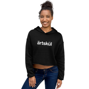 Artskul's black cropped hoodie with a white artskul logo. This hoodie is as comfortable as it is stylish. This hoodie has a drop shoulder cut and features a trendy raw hem and matching drawstring. The soft and cozy hoodie is likely to become your favorite go-to piece whether on the street, out for a hike, or lounging on the couch.